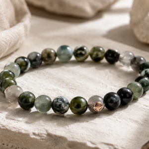 Close-up of a handcrafted gemstone bead bracelet on a wooden tray