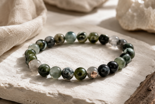Close-up of a handcrafted gemstone bead bracelet on a wooden tray