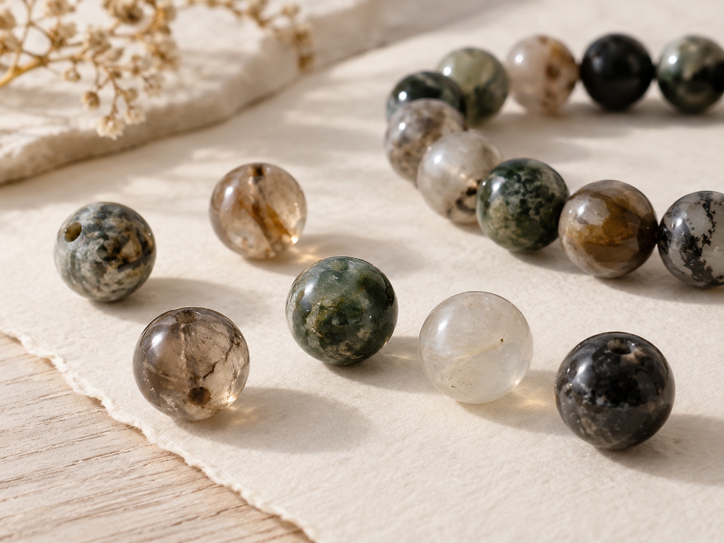 Close view of naturally varied stone beads with polished surfaces